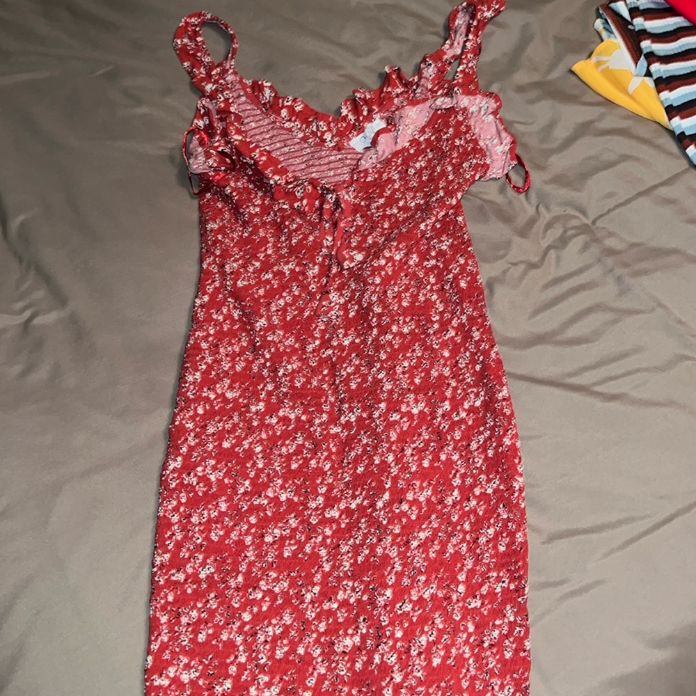 Cute summer dress. Rarely worn, stretchy style material